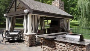 Hardscape design with outdoor kitchen and pergola